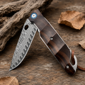 Damascus-Pattern Folding Pocket Knife with Dark Wood Handle, Blue Pivot Accent and Leather Lanyard – Rustic Collector Gift