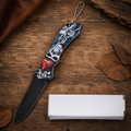 Gothic Skull Graphic Folding Pocket Knife with Black Blade & Keychain – Dark Fantasy Collector Gift
