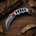 Gray Skeletonized Karambit-Style Folding Pocket Knife with Red Pivot Accent, Curved Blade and Finger Ring – Collector Gift